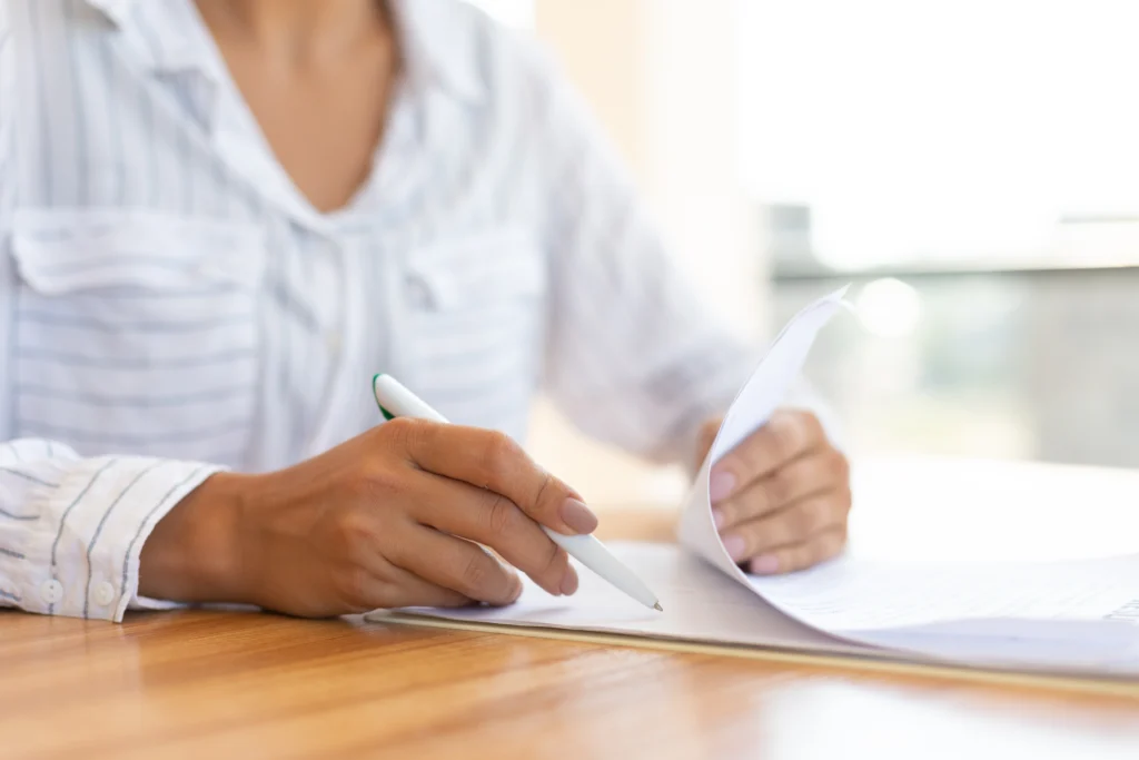 Latino immigrant completing immigration form with alien registration number