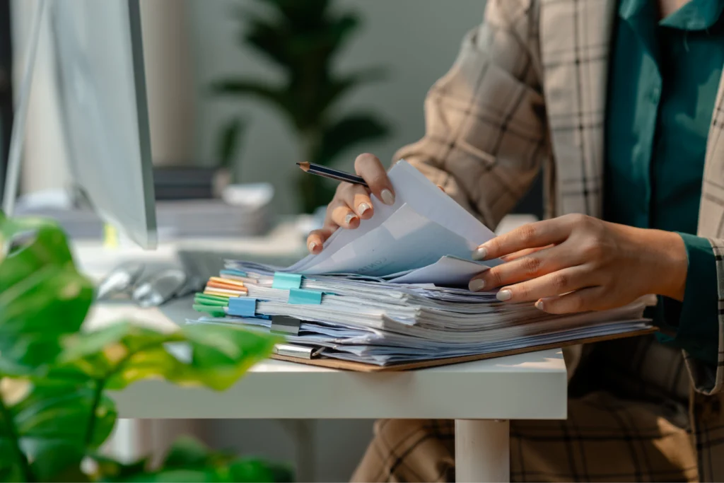 VAWA petitioner organizing identity relationship and domestic abuse evidence documents to meet VAWA petition requirements