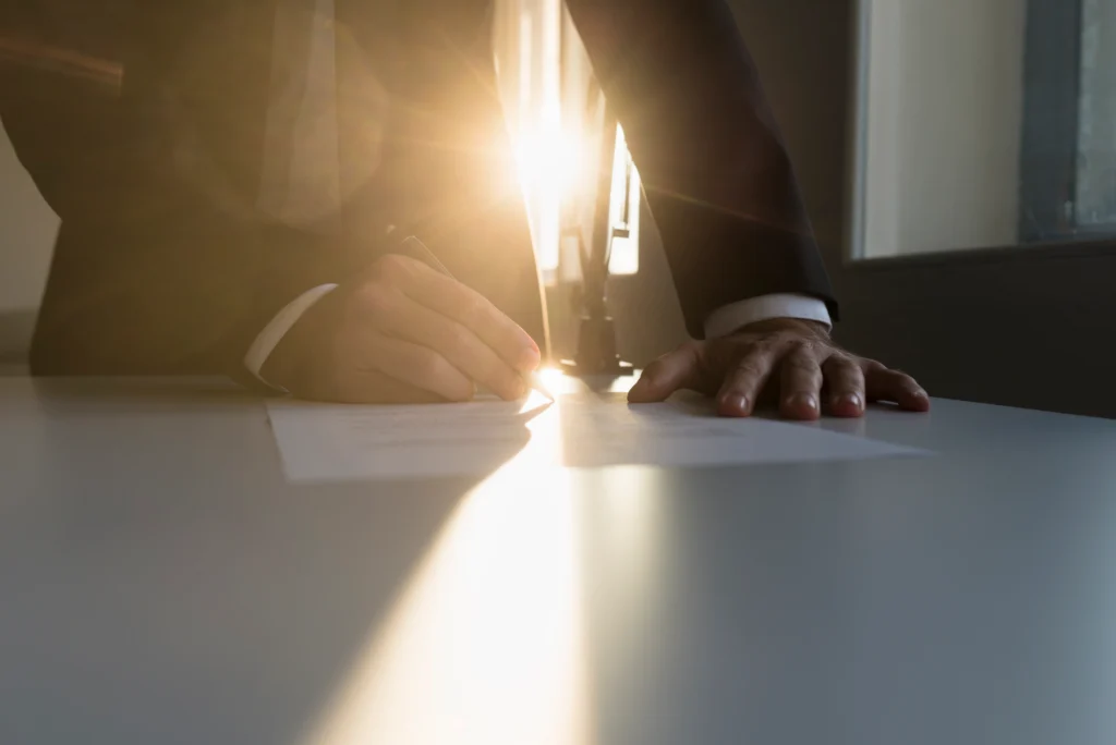 Experienced T visa immigration attorney actively preparing case file for trafficking survivor client