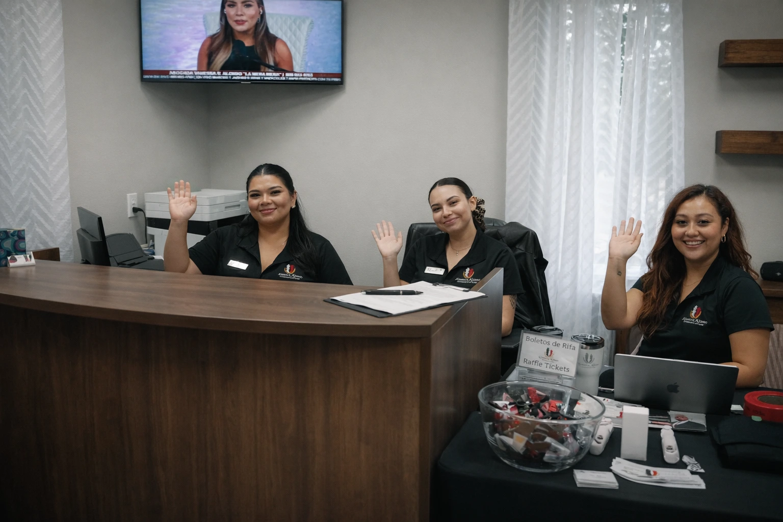 Friendly legal team welcoming immigration clients in McAllen office