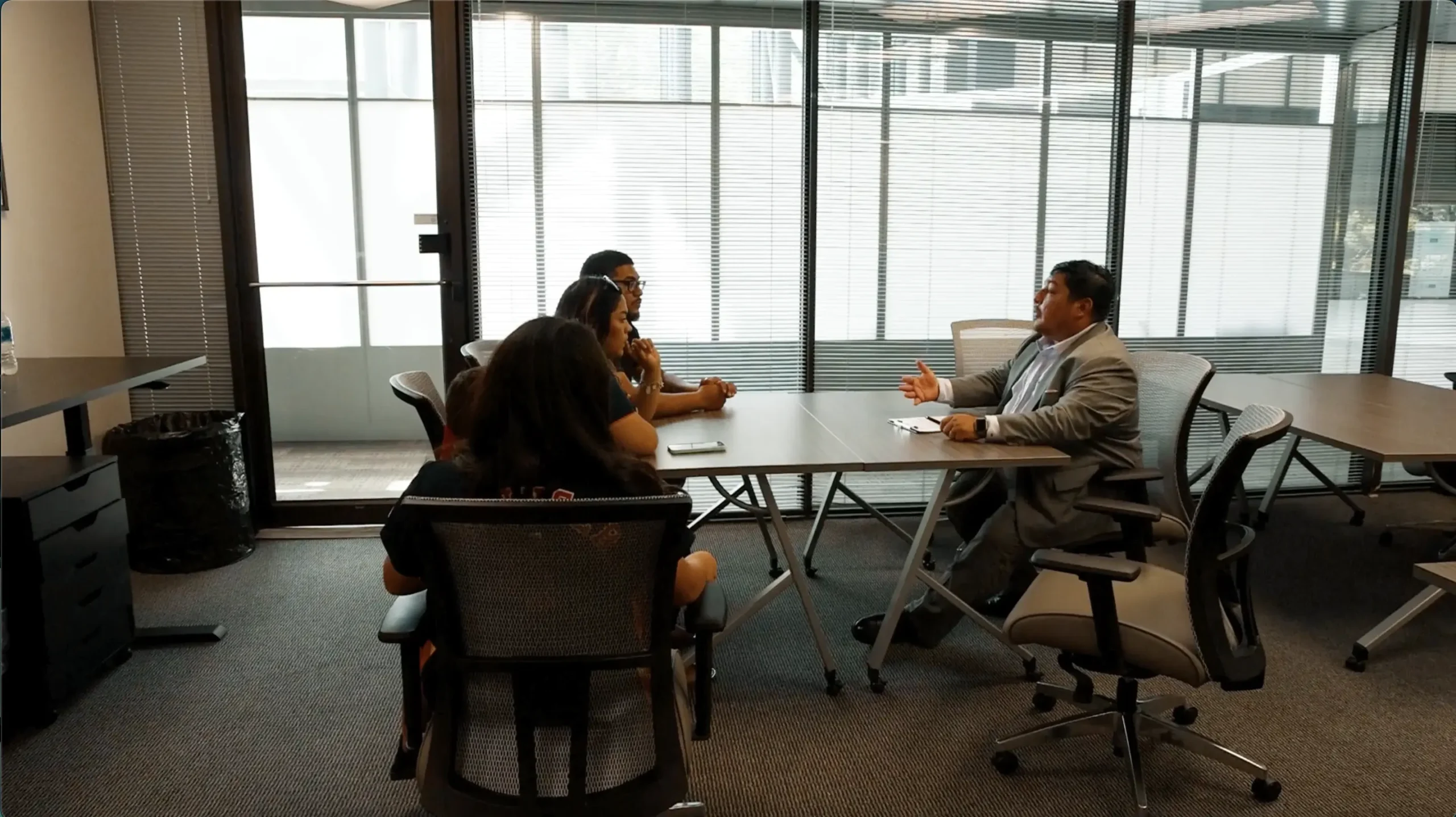 Immigration lawyer in Houston TX providing legal consultation to clients about residency, visas, and immigration processes.