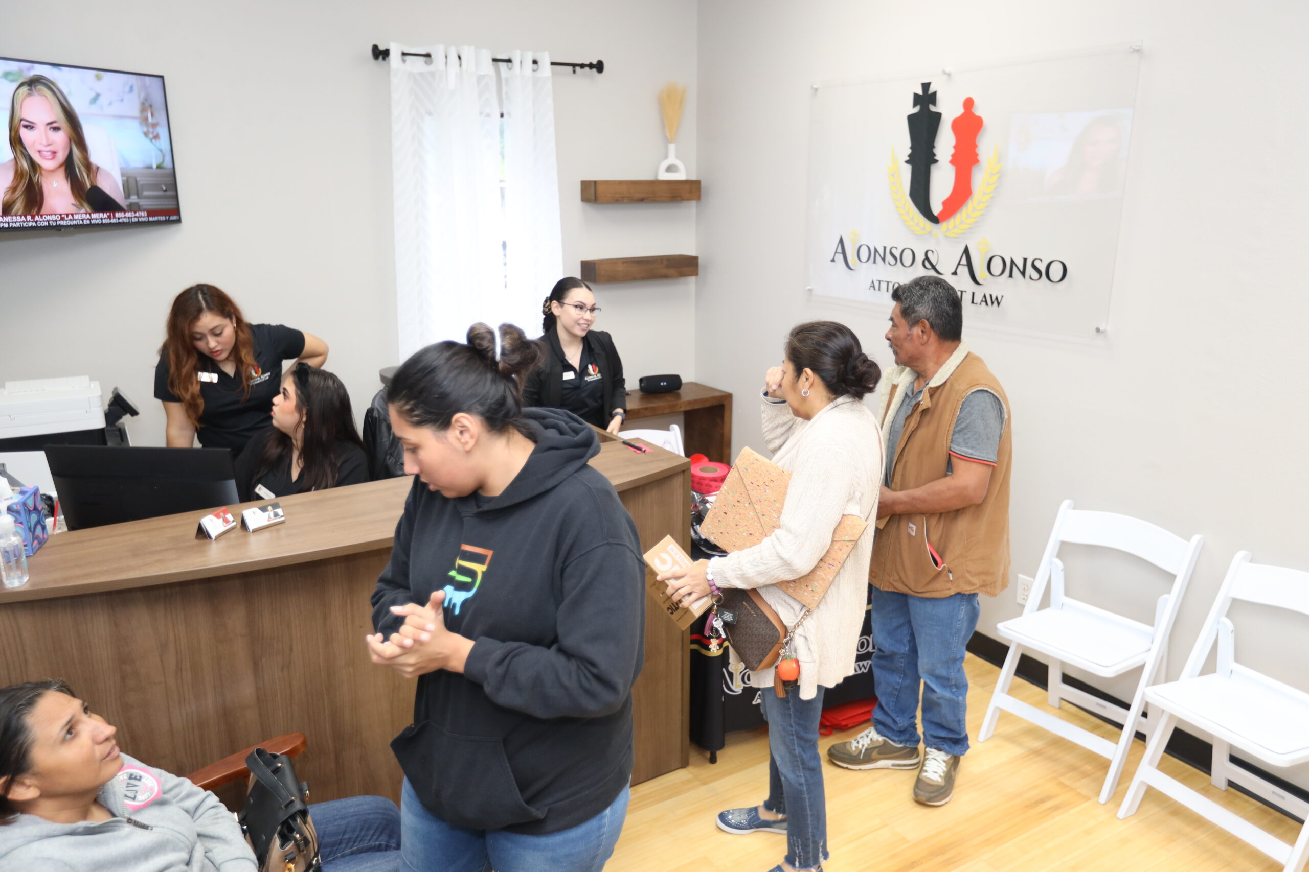 Immigration law firm legal team assisting clients with immigration cases and consultations