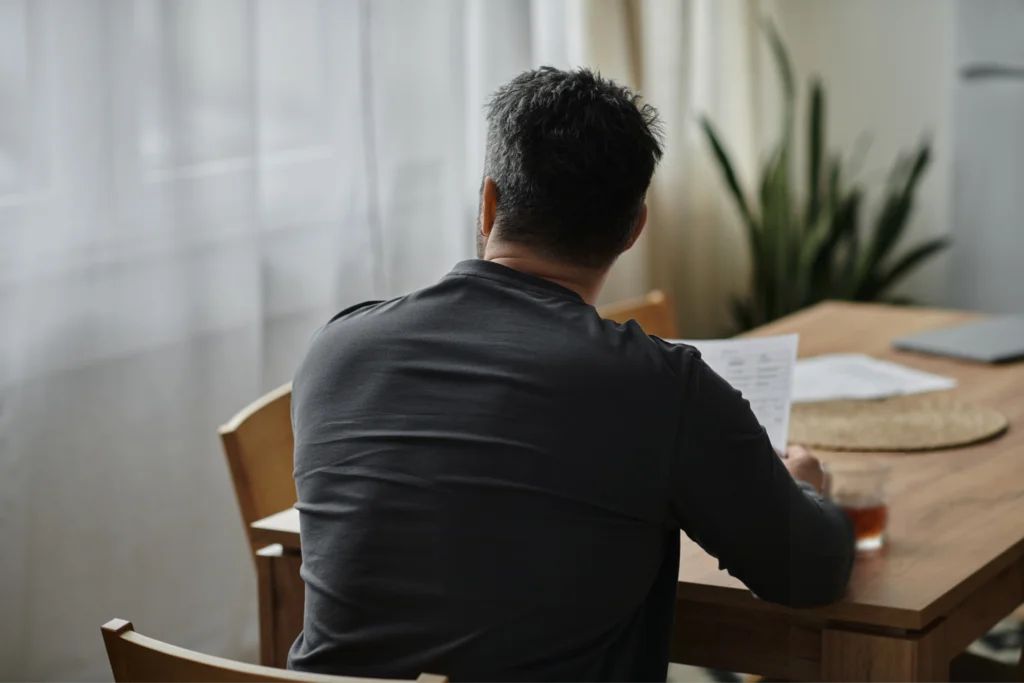 U visa applicant calmly reviewing case timeline and documents while waiting for U visa processing